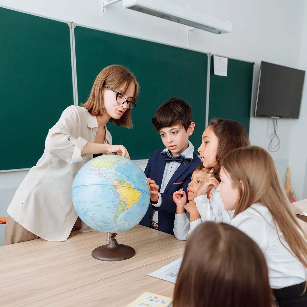 Teacher in classroom with students